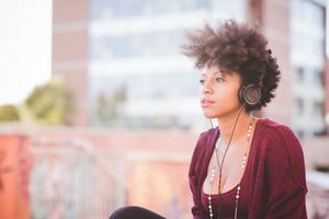 graphicstock-beautiful-black-curly-hair-african-woman-listening-music-with-headphones-in-town_HpUWBUt1-_thumb.jpg