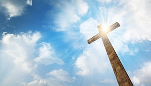 a-wooden-christian-cross-with-bright-sun-and-clouds_HQIORRZxC_thumb.jpg