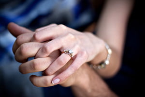 close-up-of-a-young-couples-hands-and-diamond-engagement-ring-with-platinum-and-gold-accents-shallow-depth-of-field_BtE8q0Hs_thumb.jpg
