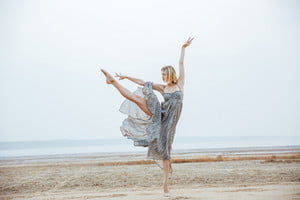 graphicstock-attractive-young-woman-ballerina-in-long-dress-dancing-on-the-beach_rOpUdO5rhg_thumb.jpg