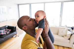 graphicstock-young-afro-american-father-at-home-holding-his-cute-baby-son-in-his-arms-kissing-him_BuZ2tvjIGW_thumb.jpg
