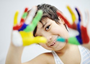 little-boy-with-hands-painted-in-colorful-paints-ready-for-hand-prints_StWouJCSo_thumb.jpg